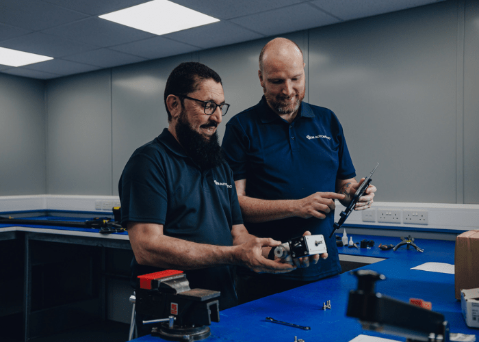 Bespoke solutions team members working together on a valve and actuator build.