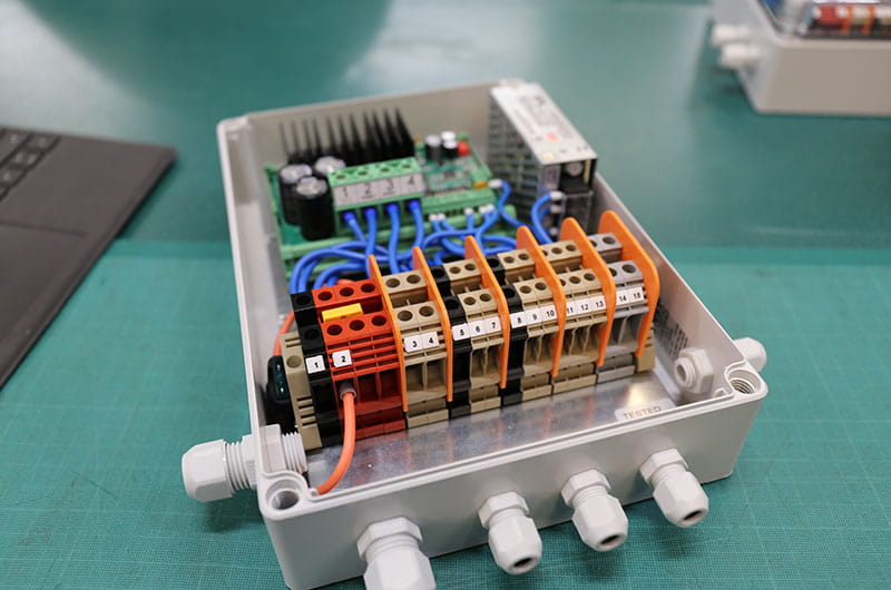 Customised enclosure including terminals, motor drive, din rail, cable glands and wiring