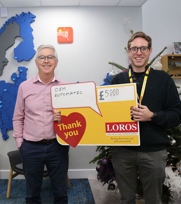 OEM Automatic present Loros with their annual donation