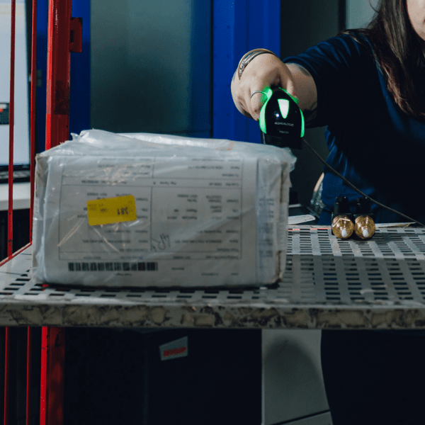 Products on a warehouse trolley, illustrating material management using datalogic barcode scanner